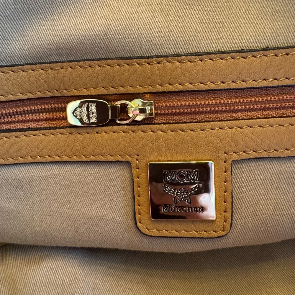💯 Guaranteed Authentic MCM Cognac Visetos Laptop Bag with strap🥀🥀PRICE IS FIRM🥀🥀
